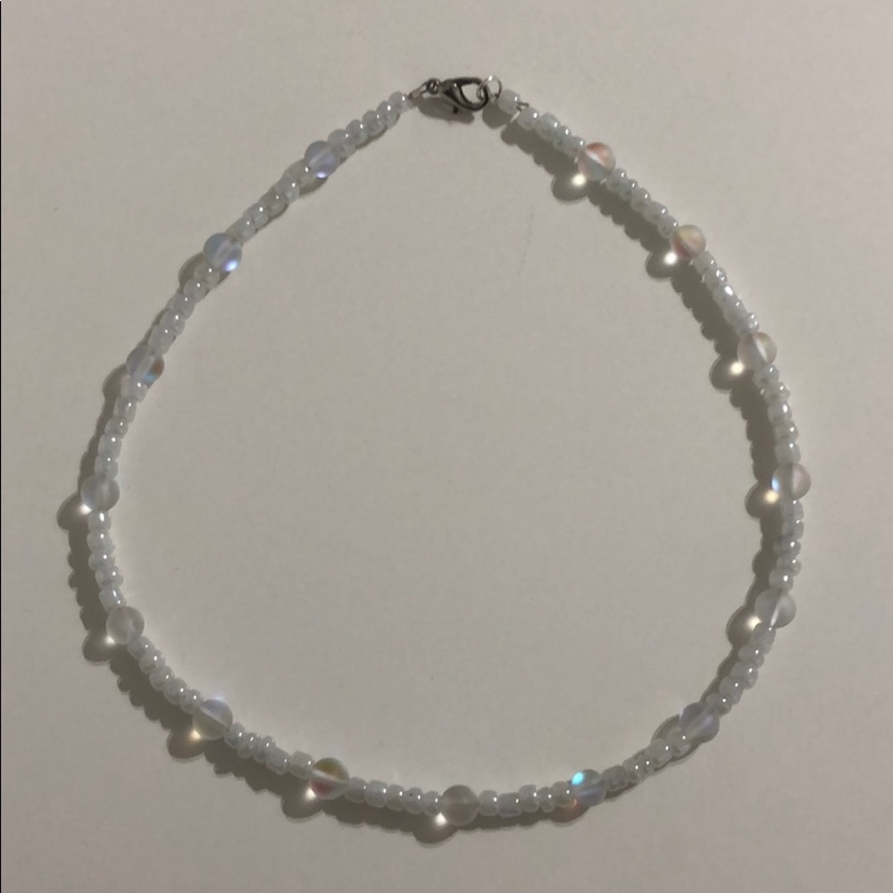 White necklace with iridescent beads